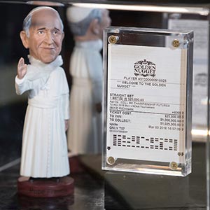 Stevens' 2018 betting slip and a figure of Pope Francis