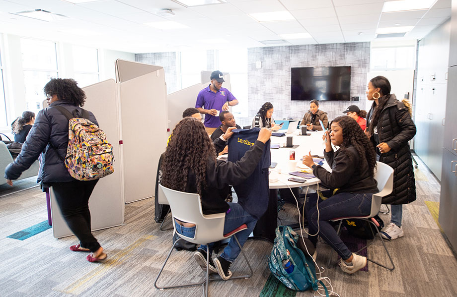 Photo of students in a workspace