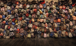 An installation of backpacks left by migrants crossing the Sonoran Desert in Arizona debuted at the U-M Institute for the Humanities in 2013. The backpacks are exhibited in the show “State of Exception/Estado de Excepción.” (Photo: Richard Barnes.)