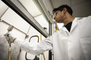 Abhishek Dhyani, Macromolecular Science & Engineering PhD Student, sprays a low interfacial toughness (LIT) coating onto a surface. Image credit: Joseph Xu, Michigan Engineering
