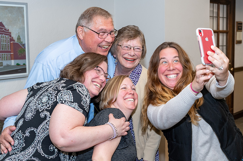 Photo of family taking a selfie at the College of Pharmacy ceremony