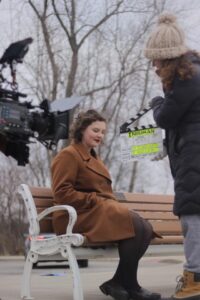 Hayley Tibbenham preparing for a take with assistant director Charlotte Beggs slating. The film was shot on an ARRI Alexa Plus (also pictured) with Zeiss CP.2 lenses. Image credit: Lauren Guido, producer