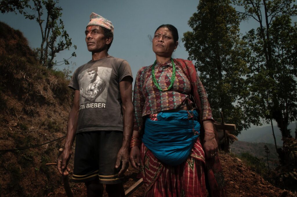Photo of a man and woman from Nepal in forest. Image credit: Johan Oldekop