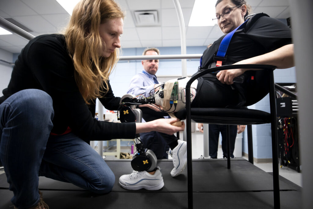Kim Ingraham, ME PhD Student and member of the Neurobionics Lab, runs tests on an open-source robotic leg with Dawn Jordan Musil. Image credit: Joseph Xu, Michigan Engineering