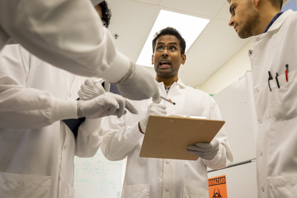 BME Assistant Research Scienstist Ramkumar Tiruvannamalai Annamalai goes through the process steps with his team to develop injectable cell clusters that create micro-climates accelerating bone regeneration. Image credit: Robert Coelius/Michigan Engineering