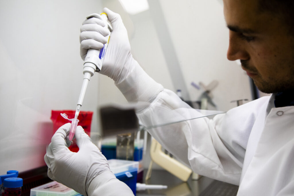 Nick Schott, BME Graduate Student Research Assistant, develops injectable cell clusters that create micro-climates accelerating bone regeneration. Image credit: Robert Coelius/Michigan Engineering