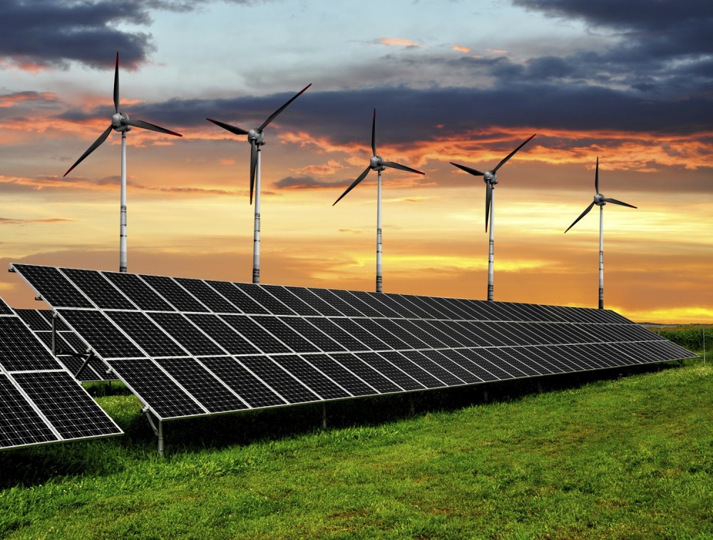 Solar panels and wind turbines. Image credit: iStock