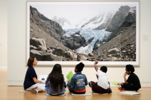 Visitors view works of art in "The World to Come: Art in the age of the Anthropocene," an exhibition on view at the U-M Museum of Art until July 29. Image credit: Mark Gjukich