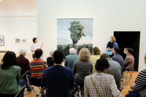 Visitors view works of art in "The World to Come: Art in the age of the Anthropocene," an exhibition on view at the U-M Museum of Art until July 29. Image credit: Mark Gjukich