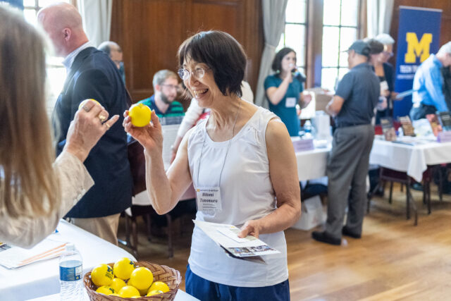 Photo of Hitomi Tonomura, professor of history and women's studies, holding a complimentary “stress ball.”