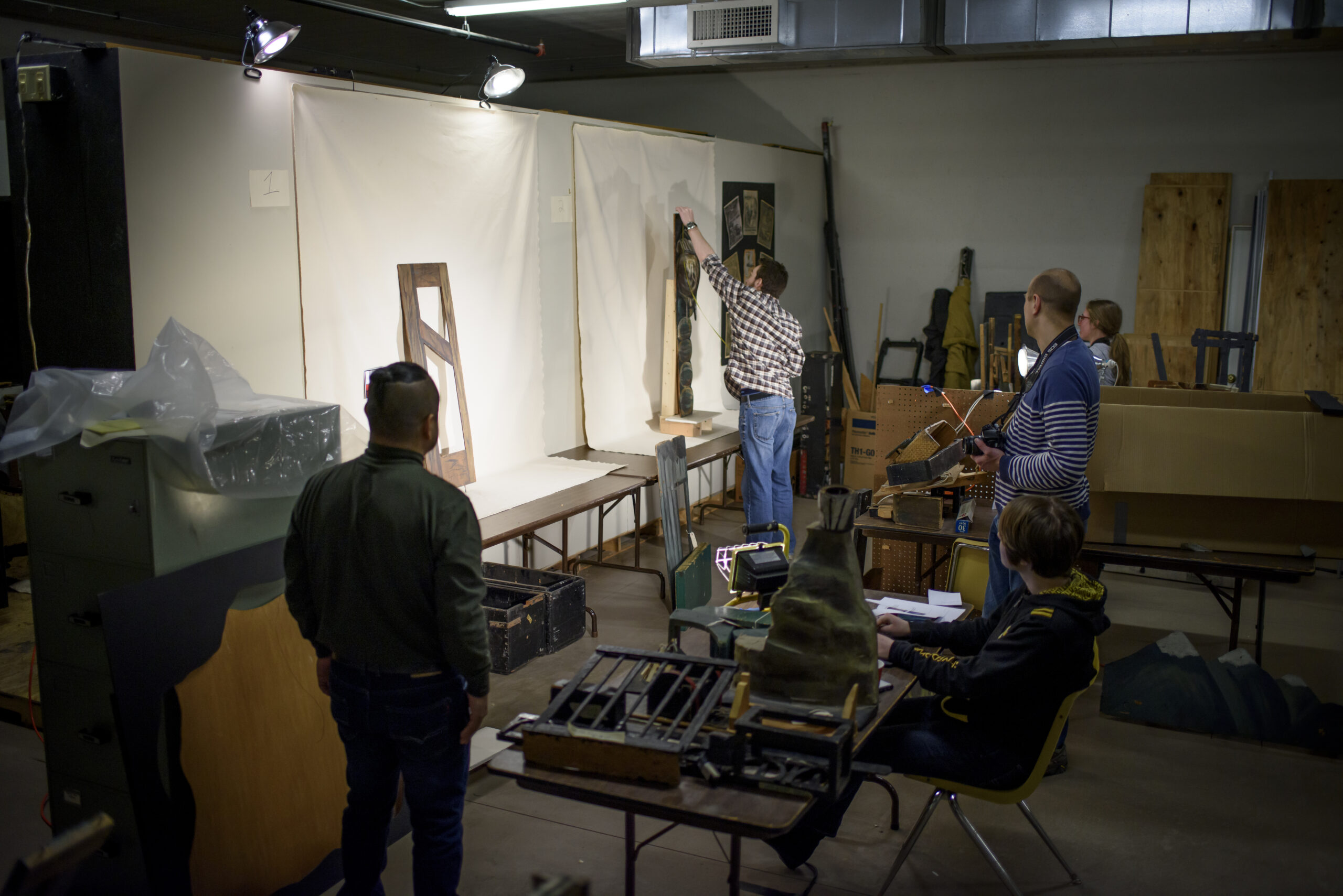 A team led by U-M alumna Hilary Severyn works to create a digital archive of Meredith Bixby's marionettes, props, and backdrops. Photo by Jeffrey M. Smith / University of Michigan School of Information.