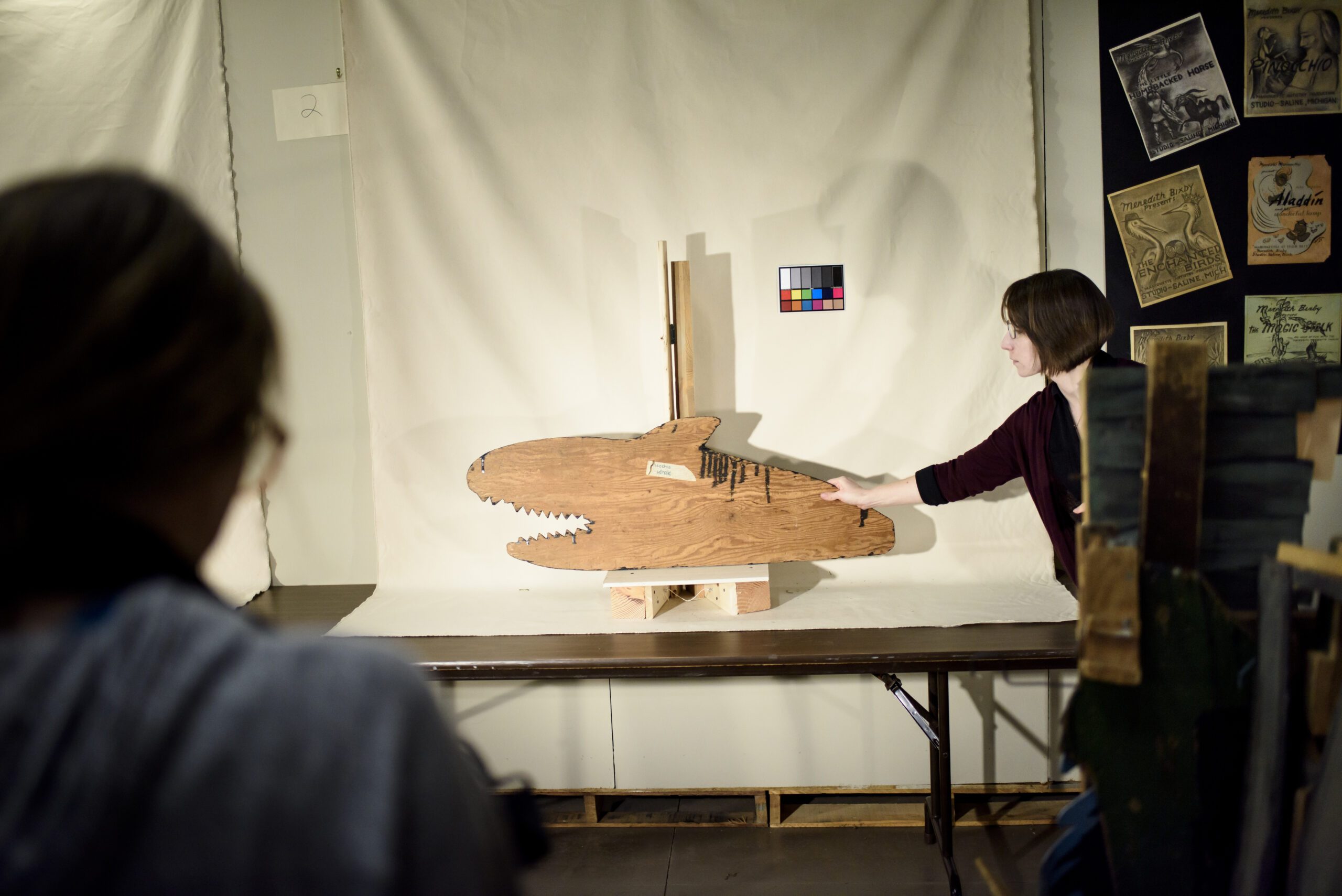 A team led by U-M alumna Hilary Severyn works to create a digital archive of Meredith Bixby's marionettes, props, and backdrops. Photo by Jeffrey M. Smith / University of Michigan School of Information. Photo by Jeffrey M. Smith / University of Michigan School of Information.