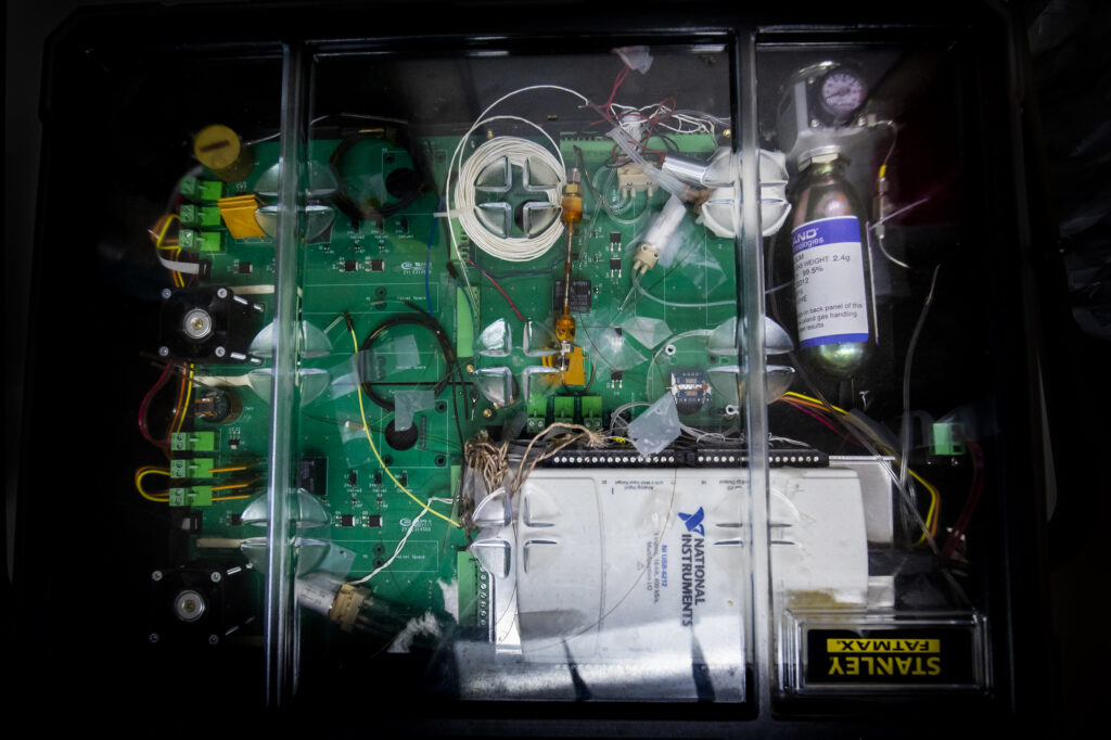 Looking inside the protective covering of a portable breath monitor developed by the University of Michigan that can quickly and accurately detect acute respiratory distress syndrome (ARDS) inside the critical care unit at the University of Michigan Hospital on July 2, 2019. Photo by Robert Coelius/Michigan Engineering, Communications and Marketing