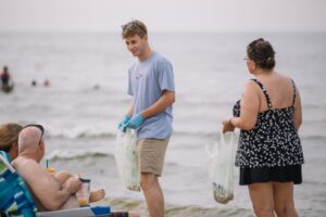 Community gathered on a Muskegon Pere Marquette Beach day clean-up and collected 43.5 pounds of waste. Image courtesy: Jackson Riegler