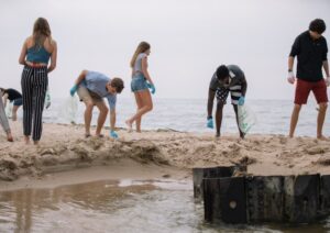Community gathered on a Muskegon Pere Marquette Beach day clean-up and collected 43.5 pounds of waste. Image courtesy: Jackson Riegler