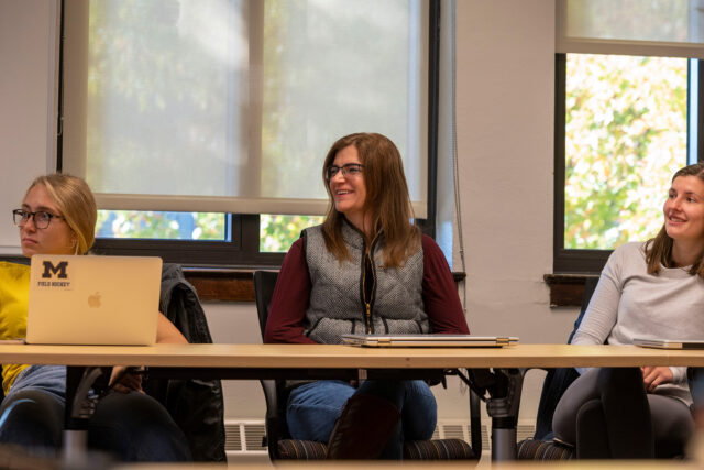 Stephanie Steiner (center) listens during one of the classes she's taking toward her goal of becoming an elementary school teacher.