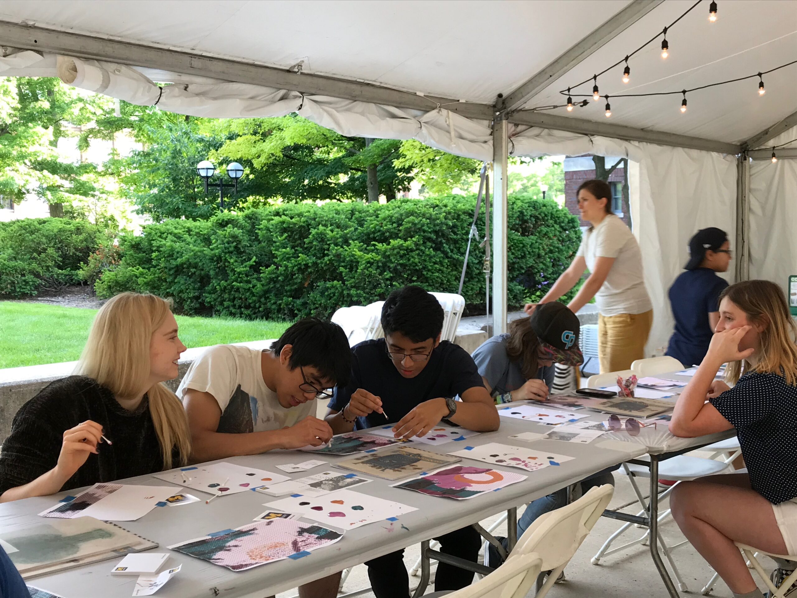 Participants in a creation sessions for the Connect the Dots Project use the Pixel Technique at the Ann Arbor Summer Festival