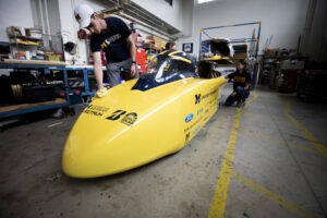 People cleaning Michigan Solar Car
