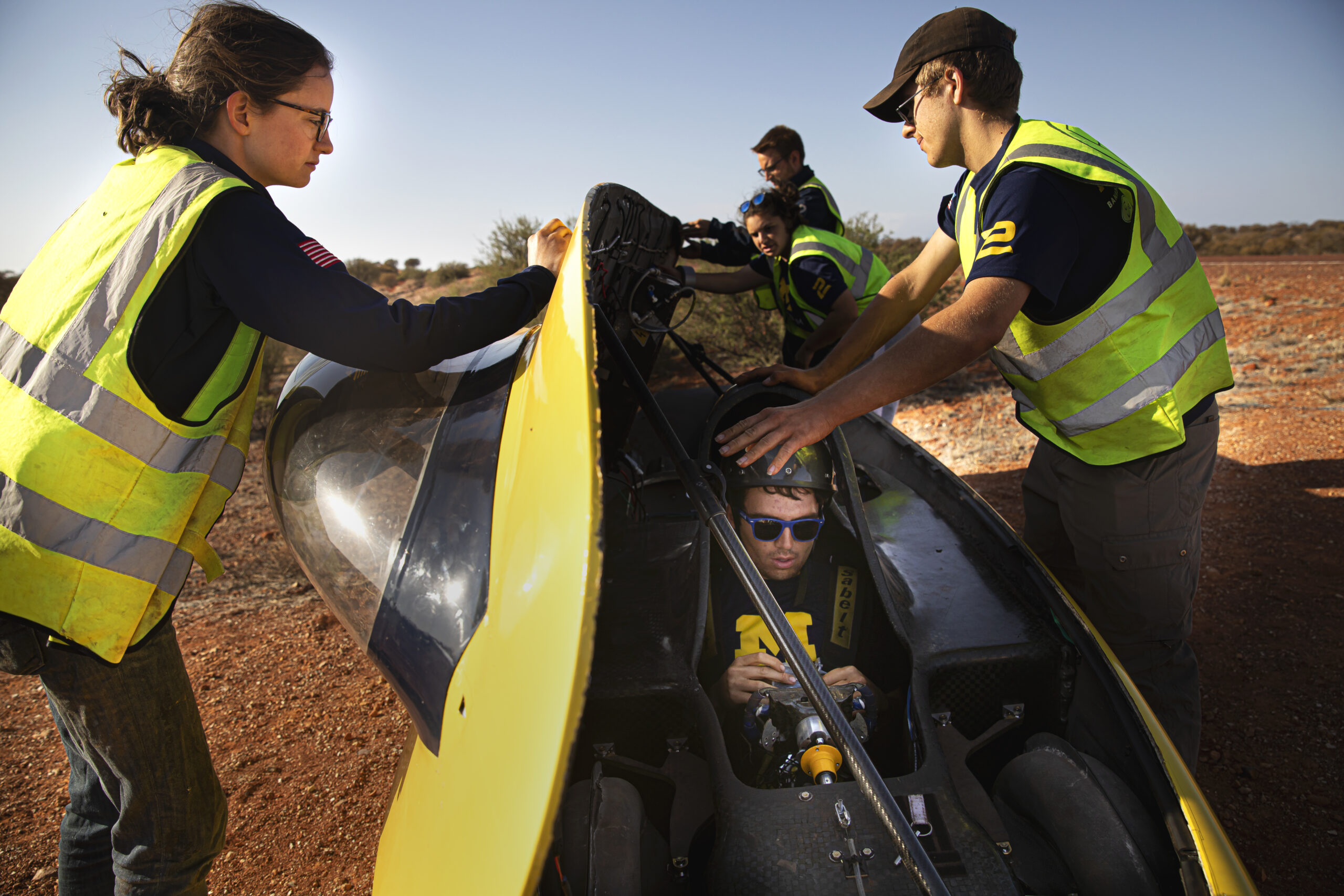 Grace VanRenterghem, race mechanical engineer, checks the angle of Electrum’s solar array during charging on day four. Photo: Joseph Xu/Michigan Engineering