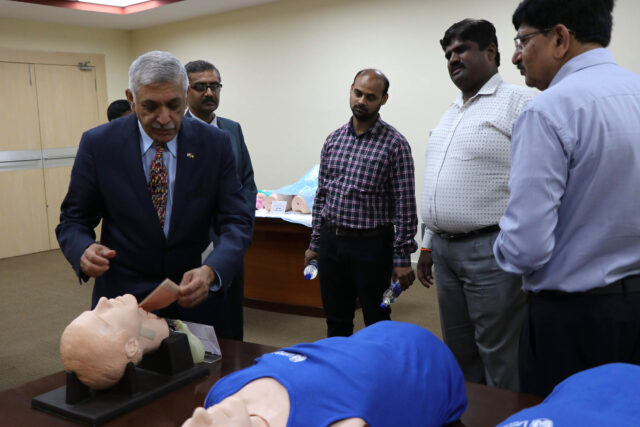 Krishnan Raghvendran, U-M professor of surgery, demonstrates a procedure to advanced emergency medical technicians in India.