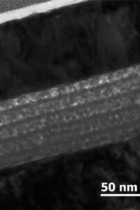 The zinc-tin-oxide semiconductor appears as five mottled gray layers in this electron microscope image. Image credit: Youngbae Son, Peterson Lab, University of Michigan.