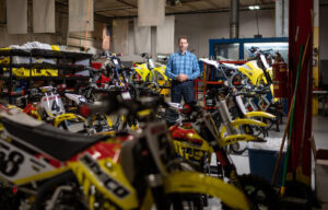 Sean Hilbert among the motorcycles. Image credit: Eric Bronson, Michigan Photography