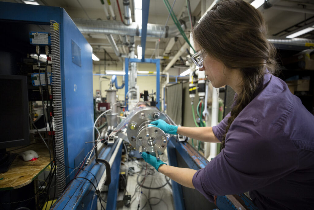Rachel Schwind demonstrates operation of the rapid compression facility to study siloxane combustion chemistry.