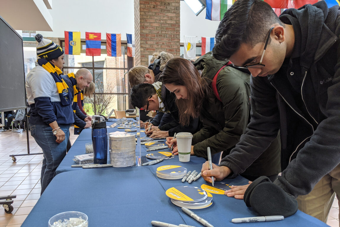 Photo of students at Pierpont Commons on the Ann Arbor campus nominating causes and organizations to receive donations on Giving Blueday.