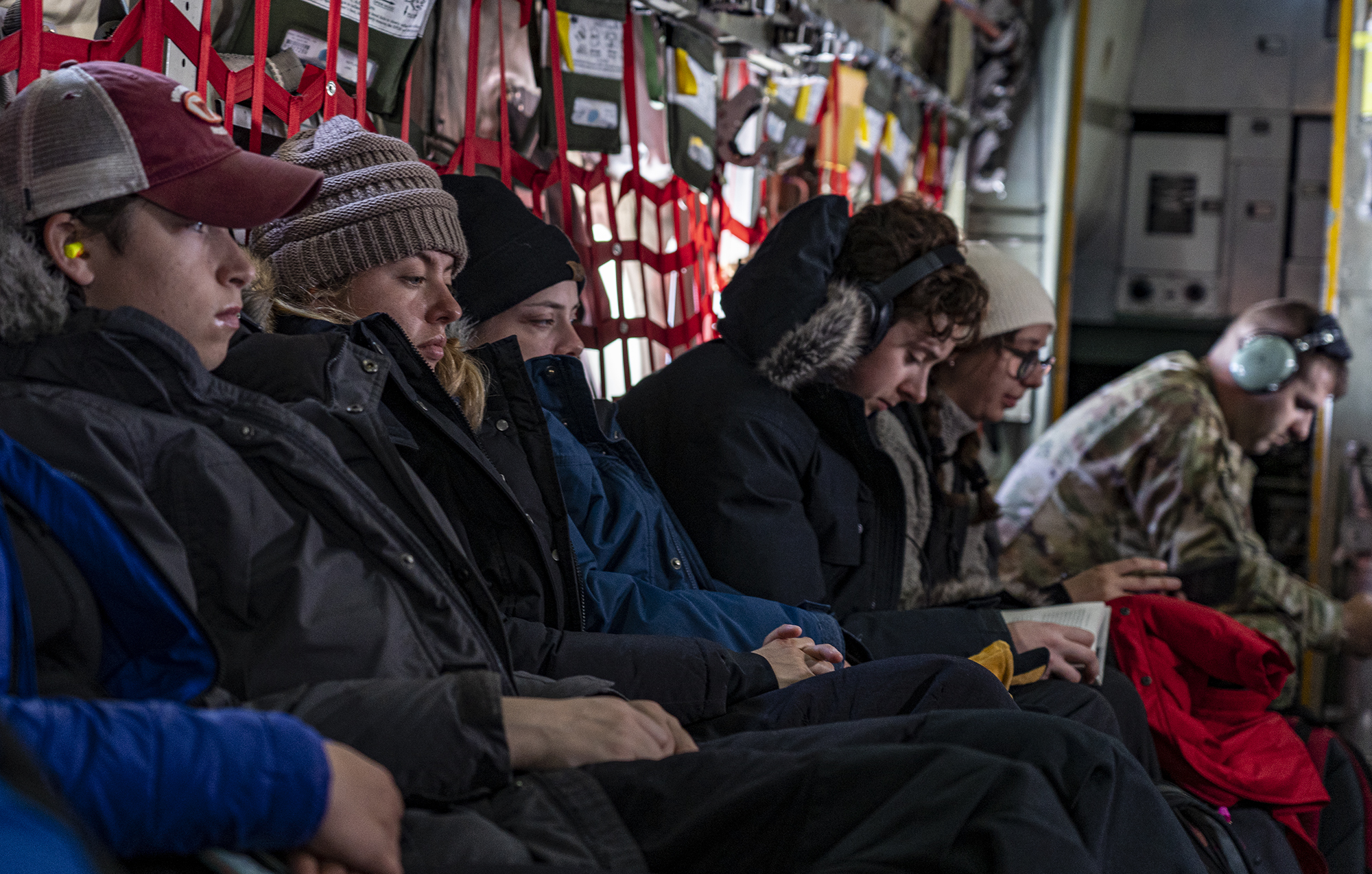 2019 Greenland Expedition students seated in a United States Air Force LC-130 Skibird en route to Greenland.