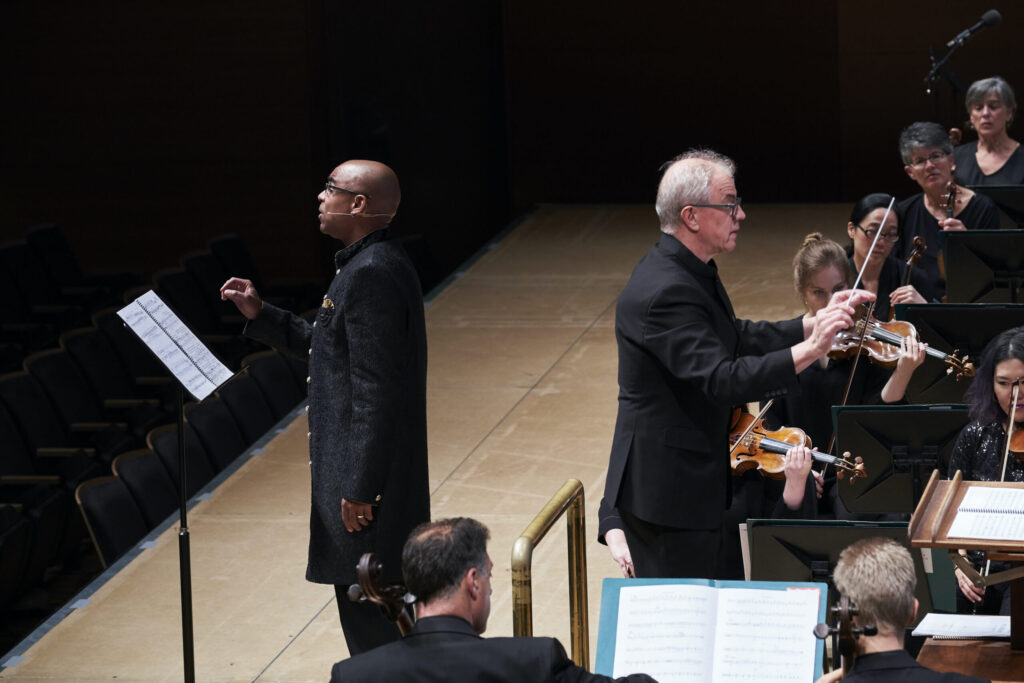 Aaron Dworkin (left) performs during the premiere "The American Rhapsody" with the Minnesota Orchestra