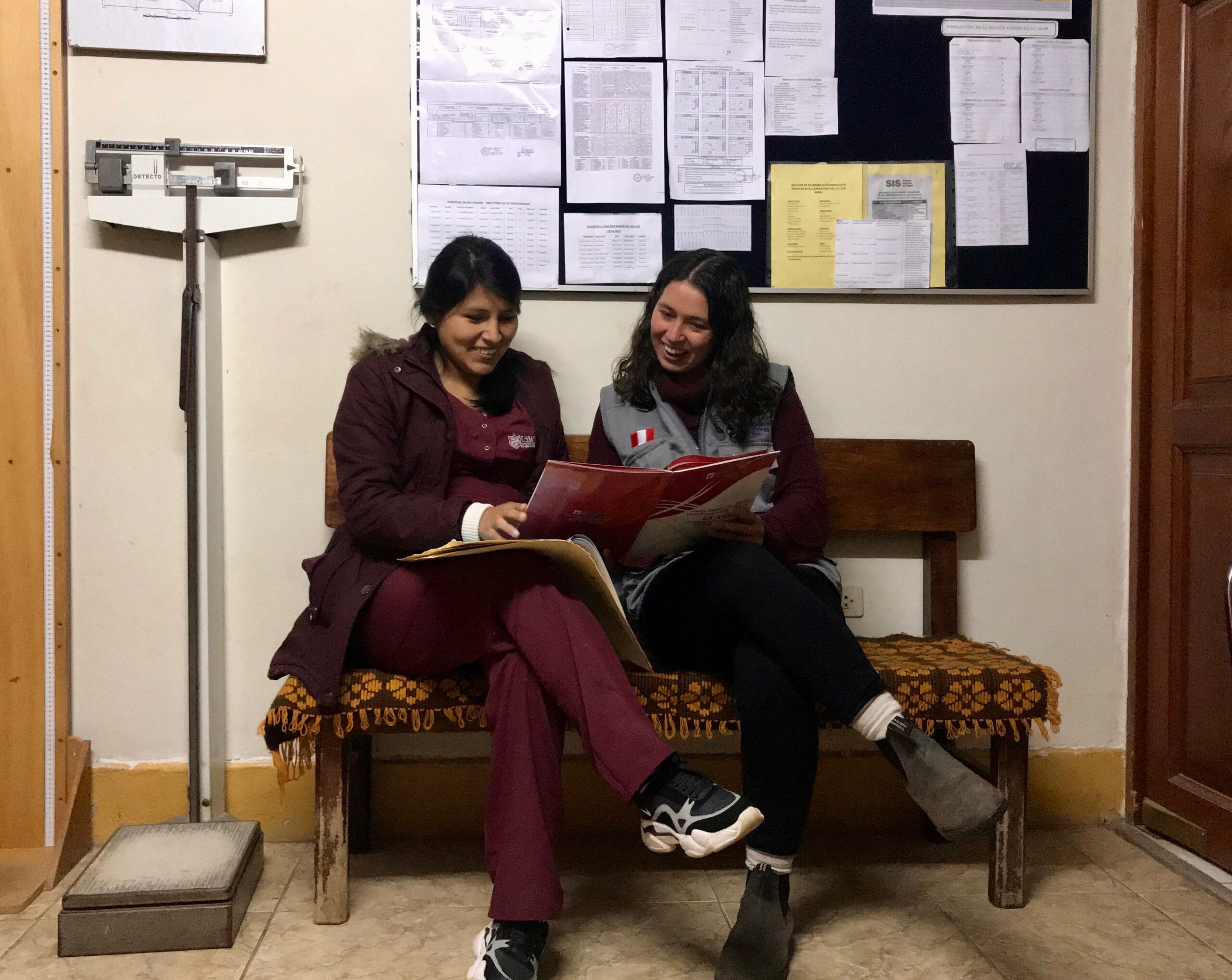 Abbey Edwards and the obstetrician at the local health post talking about anemia in pregnant women. Image credit: Peace Corps Students