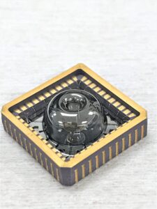 The new gyroscope with the vacuum package open, revealing the resonator inside. The resonator is almost perfectly symmetrical, made of nearly-pure glass. This enables it to vibrate for long periods, similar to the ringing of a wine glass. Image credit: Najafi Group