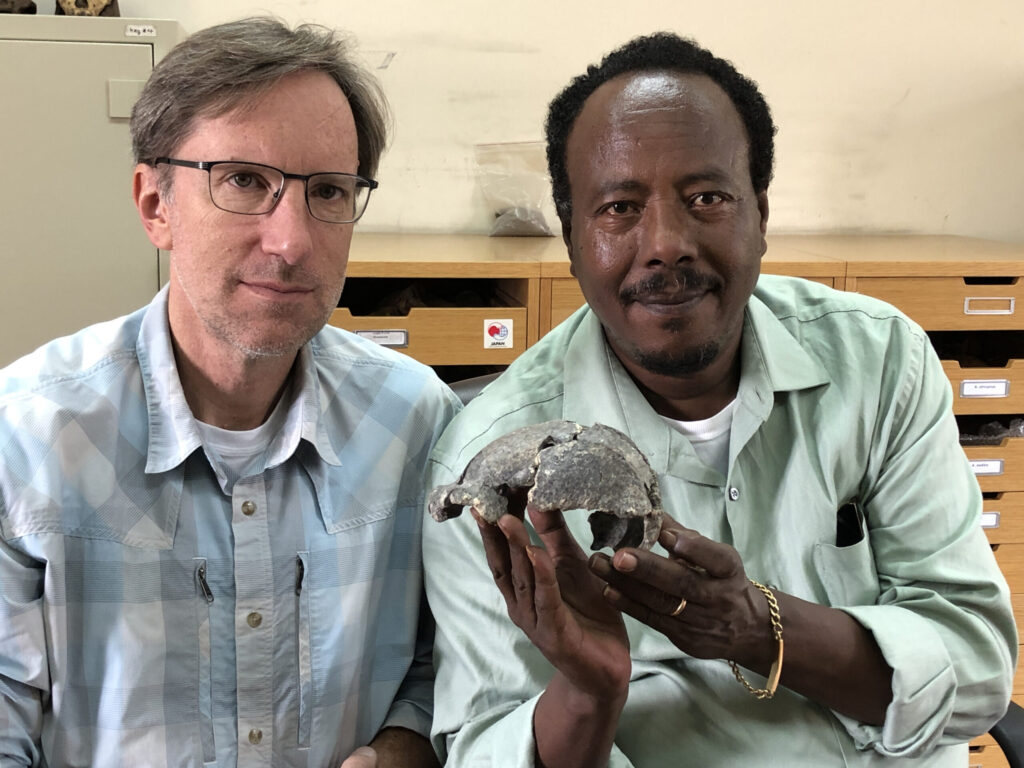 Drs. S. Semaw (right) and M. Rogers with the DAN5 cranium. Image credit: Dr. Michael J. Rogers, Southern Connecticut State University