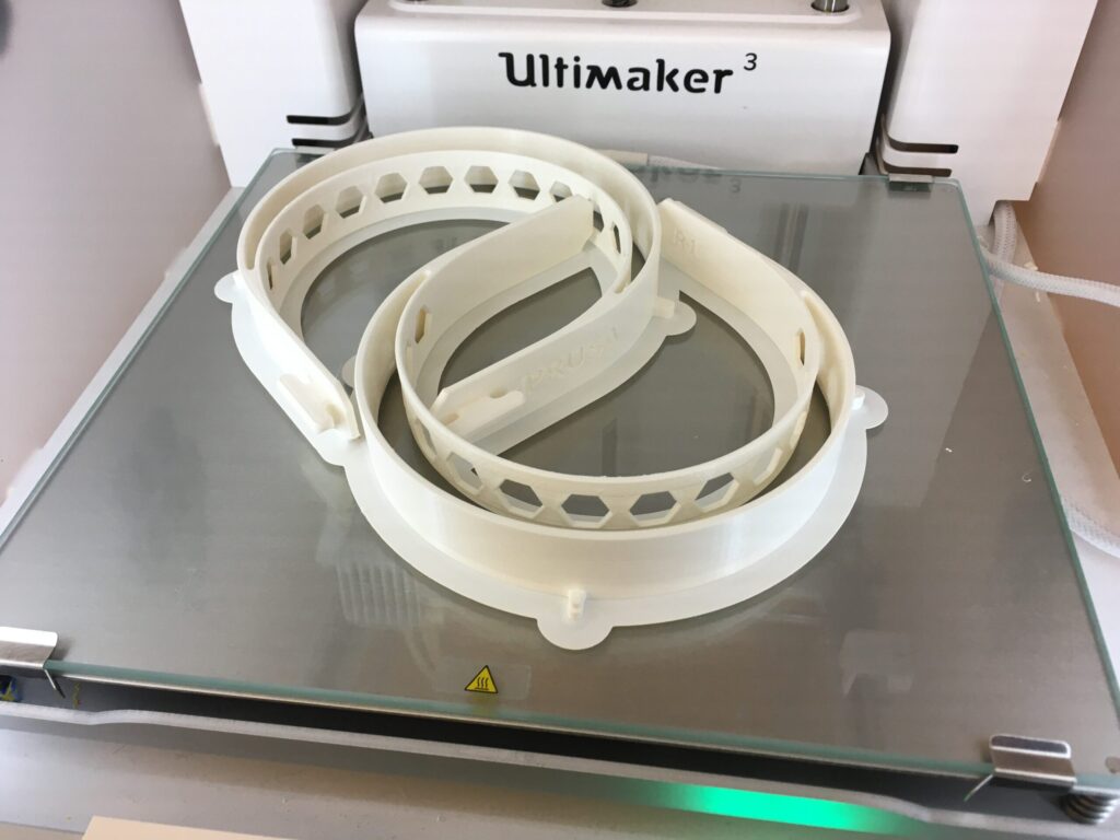 Two 3D printed headbands for the U-M/Prusa face shield, made at the Duderstadt Center’s Fabrication Studio. Image credit: Fabrication Studio at the Duderstadt Center.