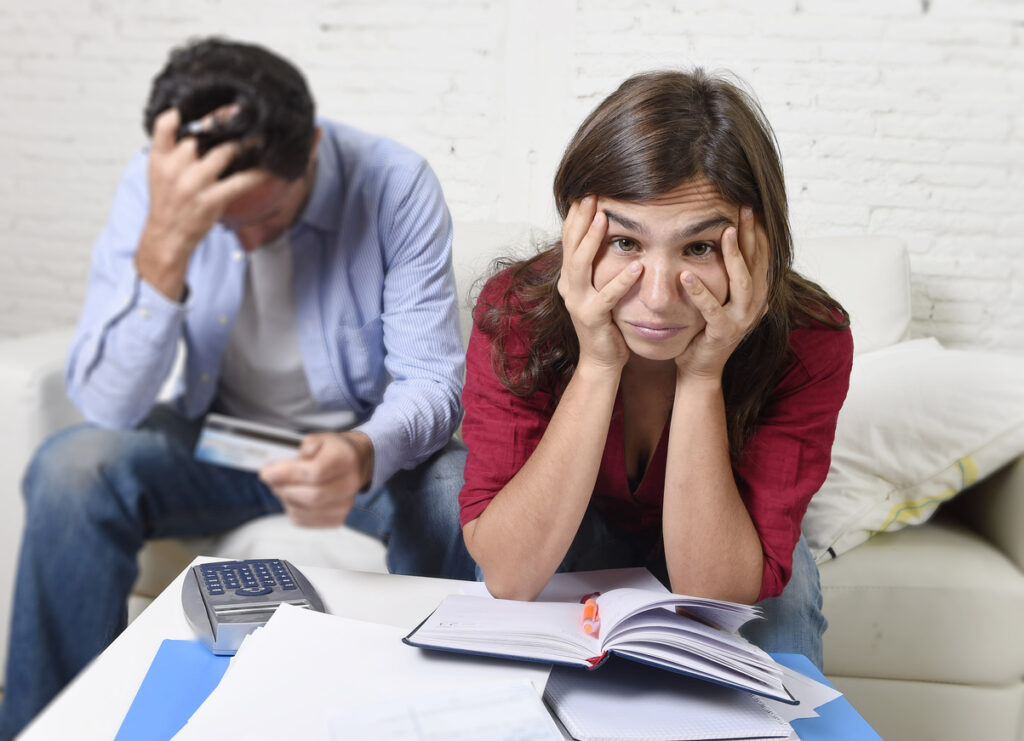 A couple stressed over money. Image credit: iStock