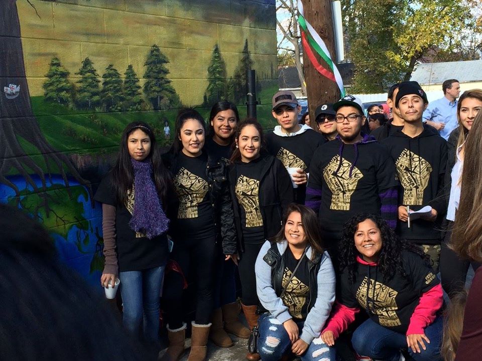 This mural is at the east outer wall of Dos Hermanos Market in Ypsilanti, Michigan designed and painted by a WICIR activist Alejandro Chinchilla and a group of teen volunteers. Image credit: Gabriella Sanford
