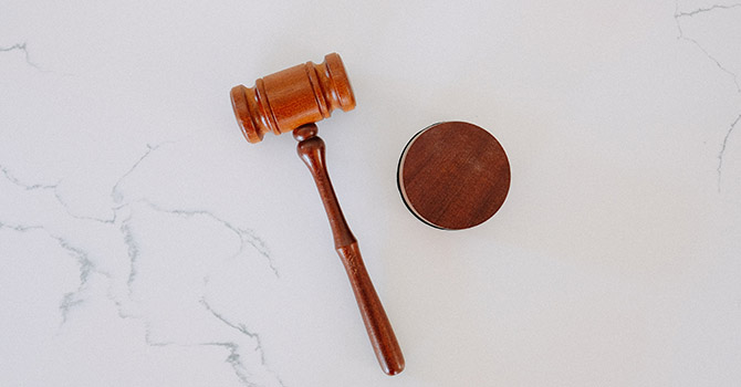 A gavel on a marble table. Image courtesy: U-M School of Public Health