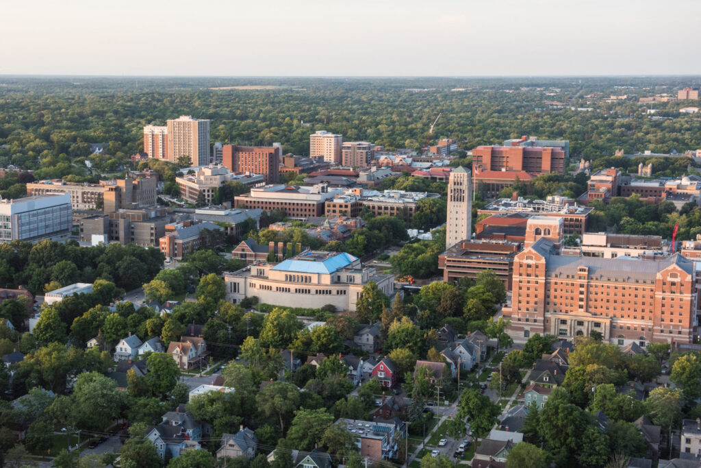 Summer Aerials: Central Campus - Burton Tower, Rackham, North Quad, Hatcher, Shapiro, UGLI, West Hall. Image credit: Michigan Photography
