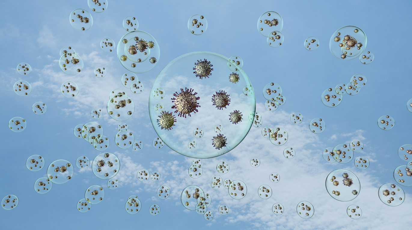 Airborn virus floating aroud in droplets on blue sky background. Image credit: iStock