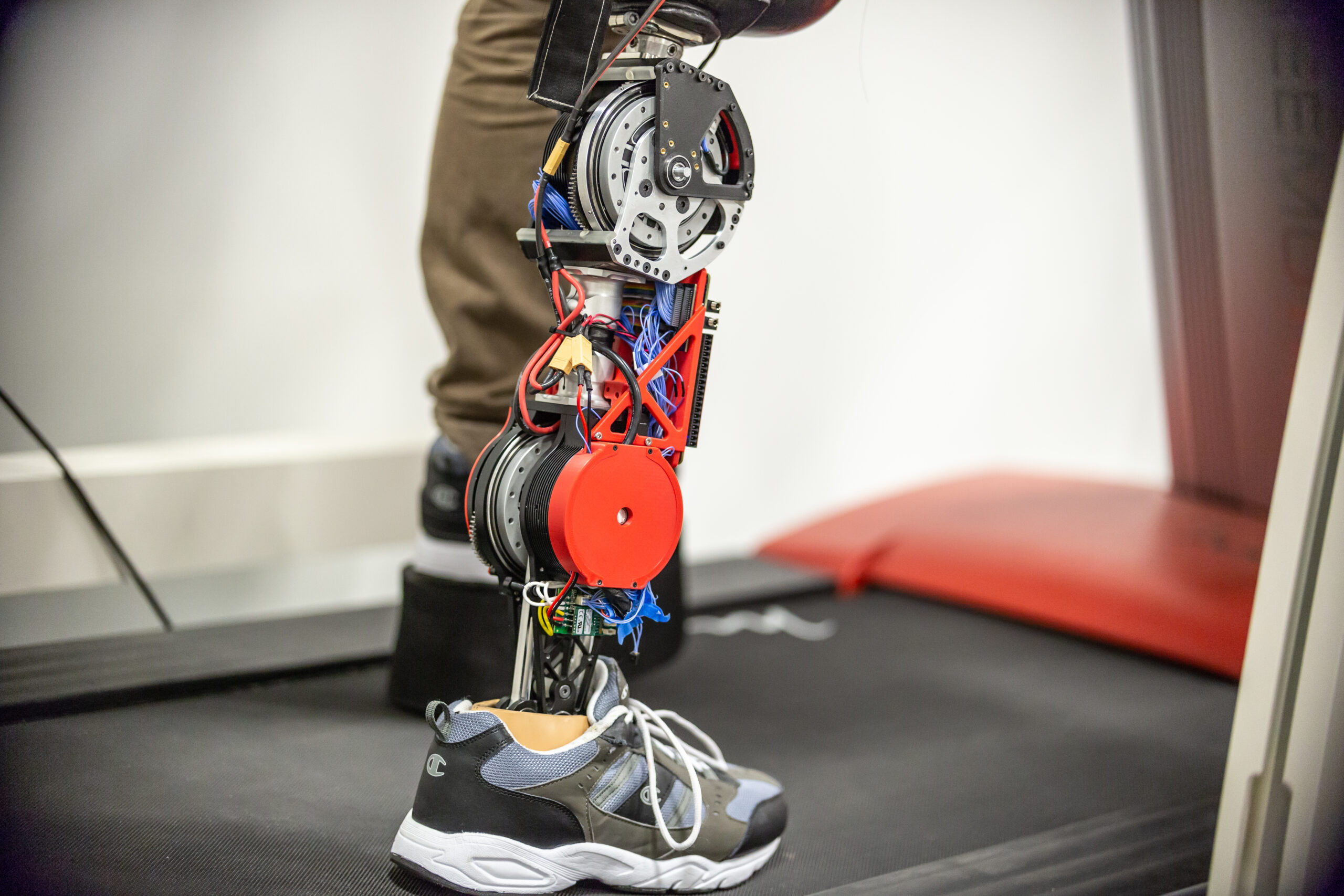 A student tests the robotic leg at the University of Texas at Dallas. The strong motors powering the knee and ankle can propel the user's body while allowing the knee to swing freely, with regenerative braking to extend battery life. Image credit: University of Texas at Dallas