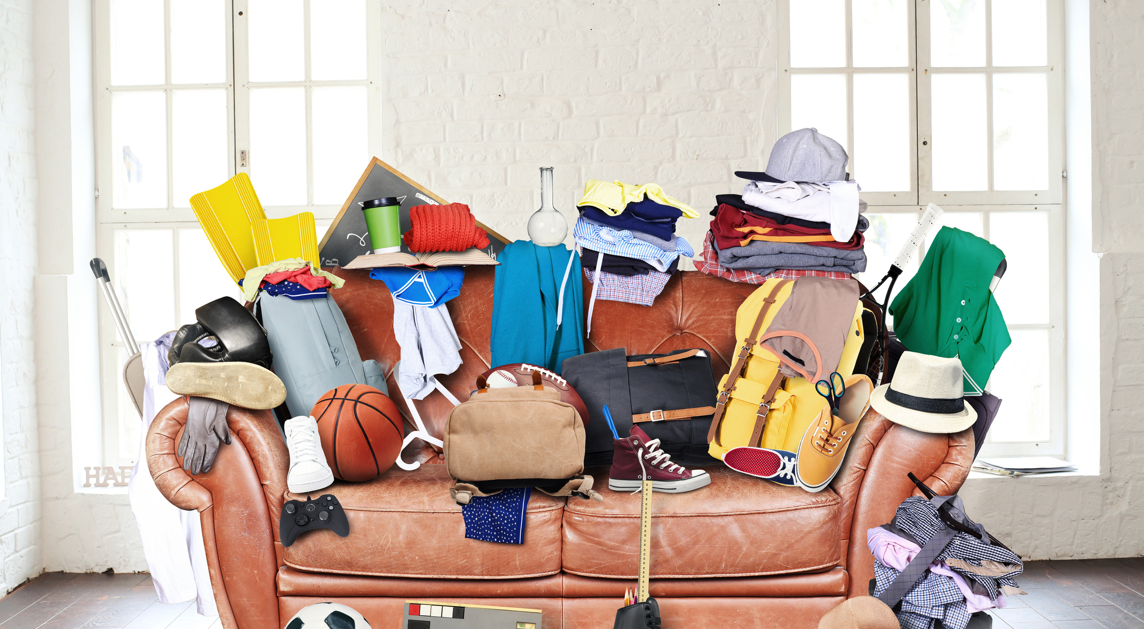 Large leather sofa with a bunch of different things Image credit: dorian2013, iStock