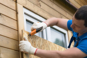 Guy boards up his home
