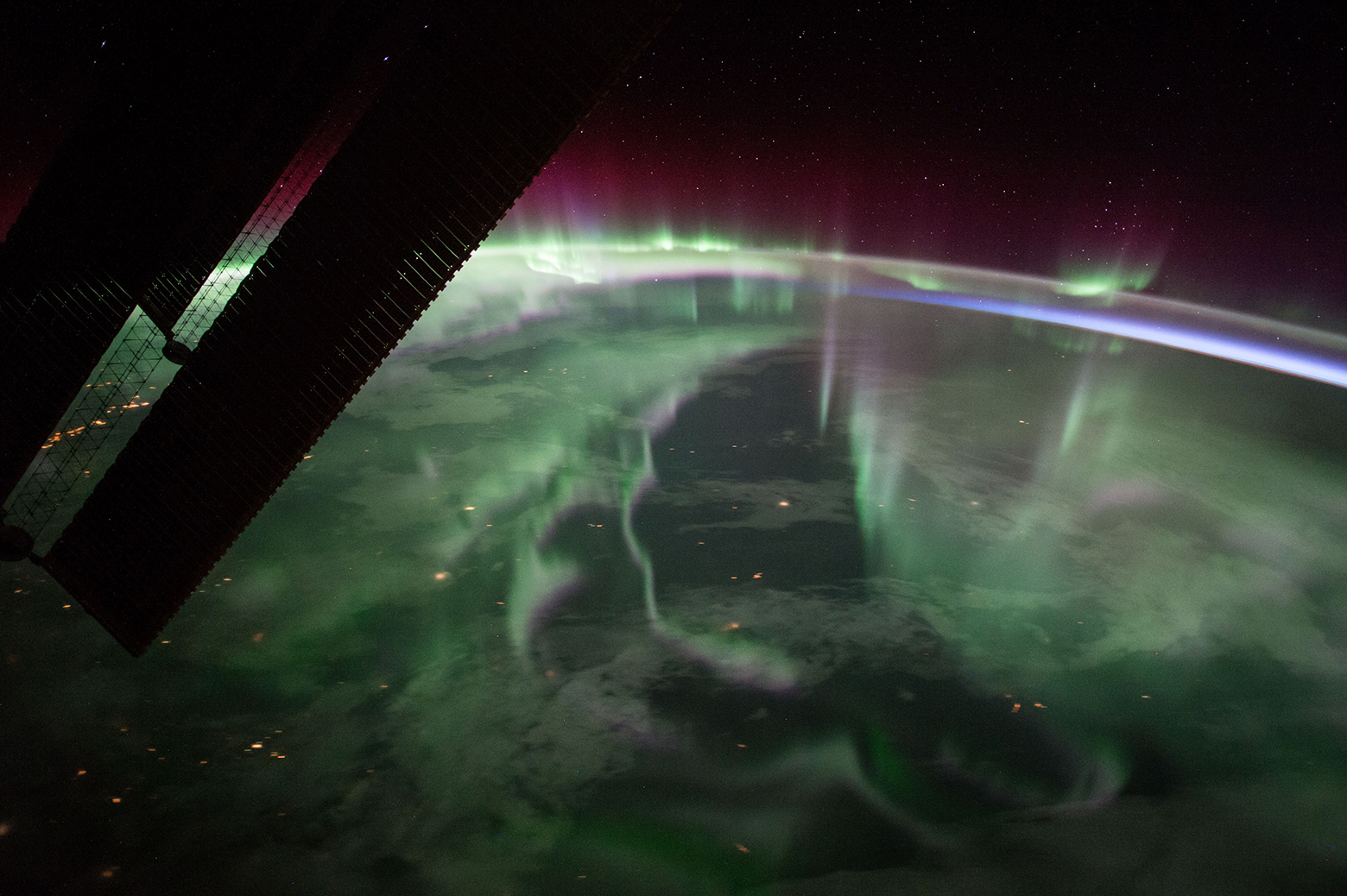 The spectacular aurora borealis, or the “northern lights,” over Canada is sighted from the International Space Station near the highest point of its orbital path. The station’s main solar arrays are seen in the left foreground. Photo: NASA