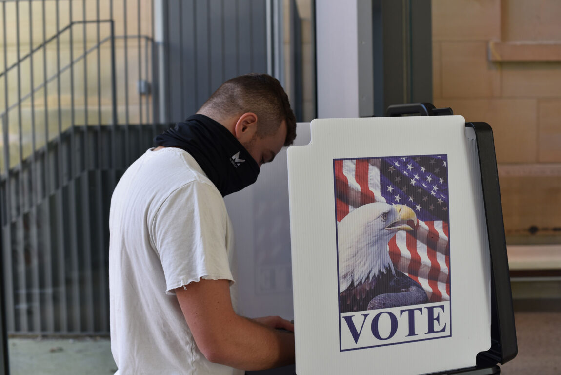 Riley Friedman, a junior at the School of Kinesiology, is a first-time voter. He cast his ballot after registering at the Ann Arbor City Clerk’s satellite office in the U-M Museum of Art. (Photo by Fernanda Pires, Michigan News)