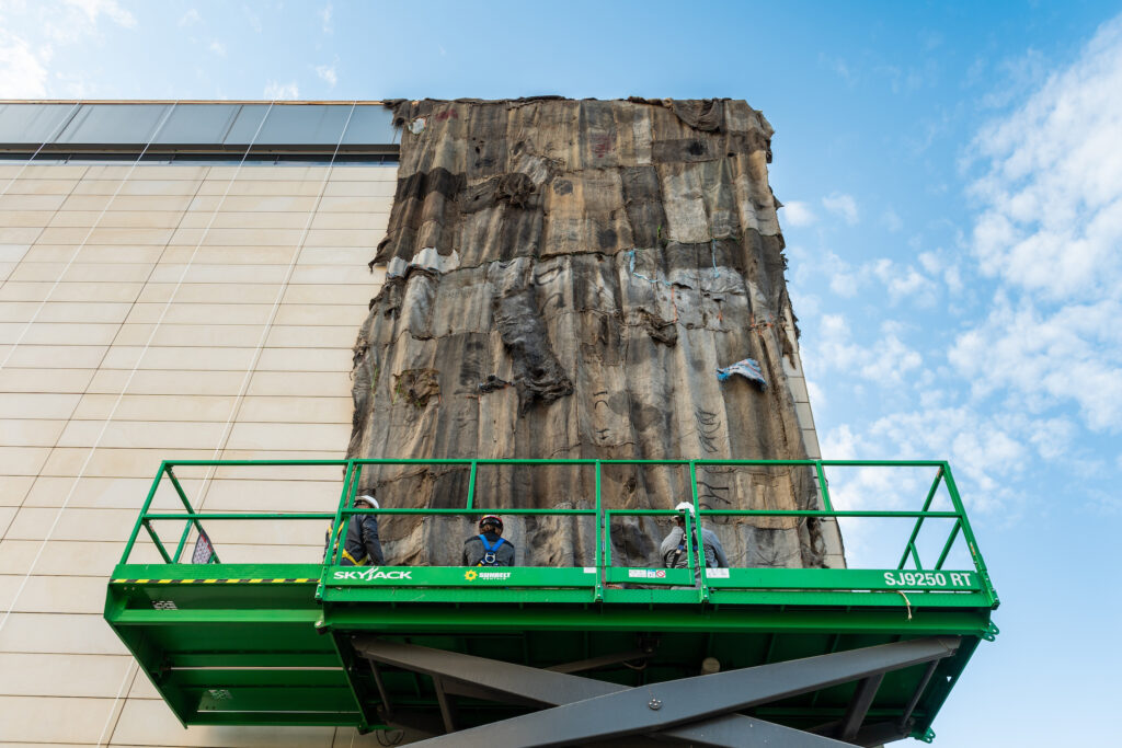 Installed last week, the resulting massive, quilt-like panels were used to cover 4,452 square feet of the exterior of the U-M Museum of Art to create one of the spectacular architectural interventions Mahama is known for. Image credit: Eric Bronson, Michigan Photography