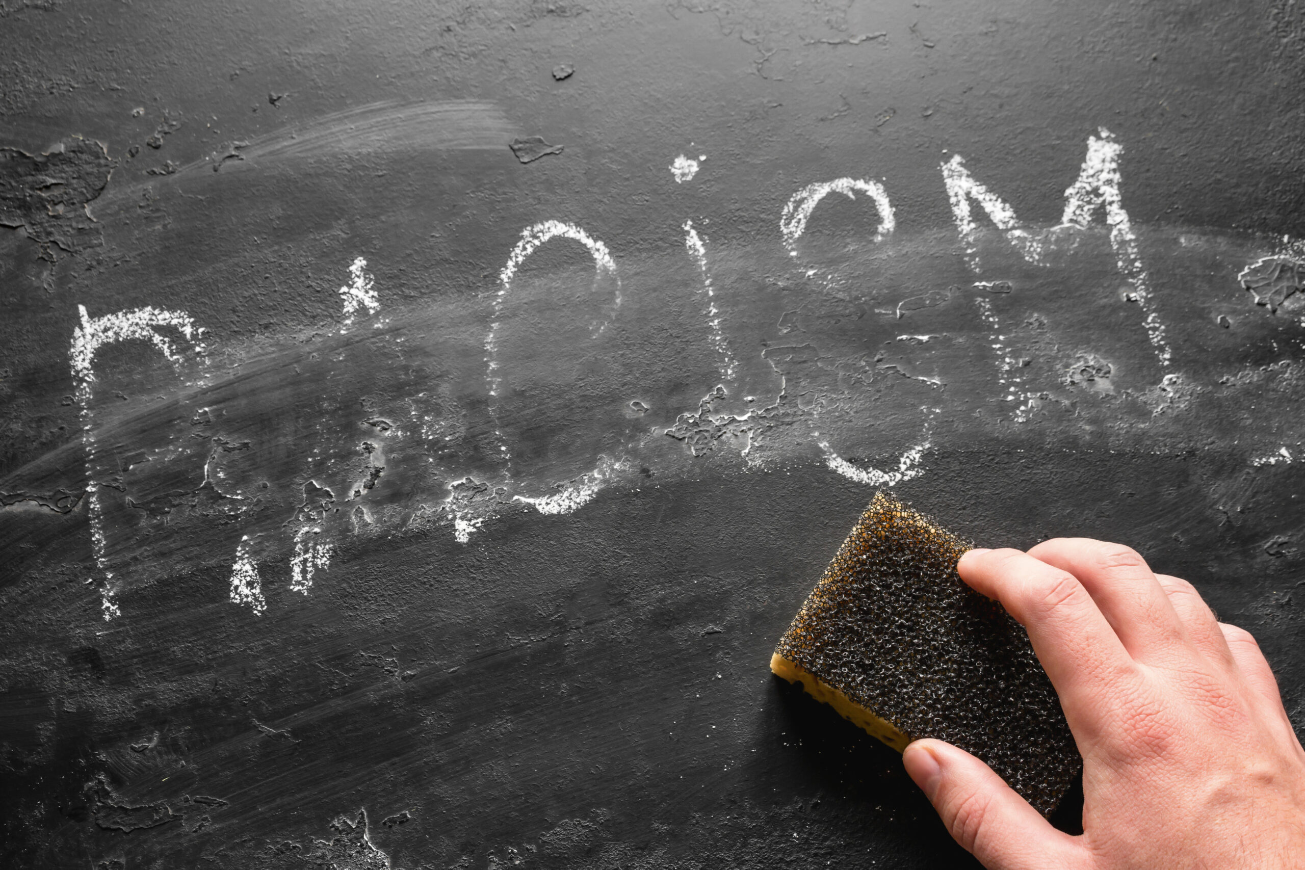erases the inscription racism. anti-racism concept, stop racial issues. Image credit: iStock