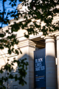 As part of a commitment to anti-racist actions during thr 2020-21 year, University of Michigan Museum of Art installed a Black Lives Banner at their Alumni Memorial Hall entrance. Image credit: Eric Bronson/Michigan Photography.