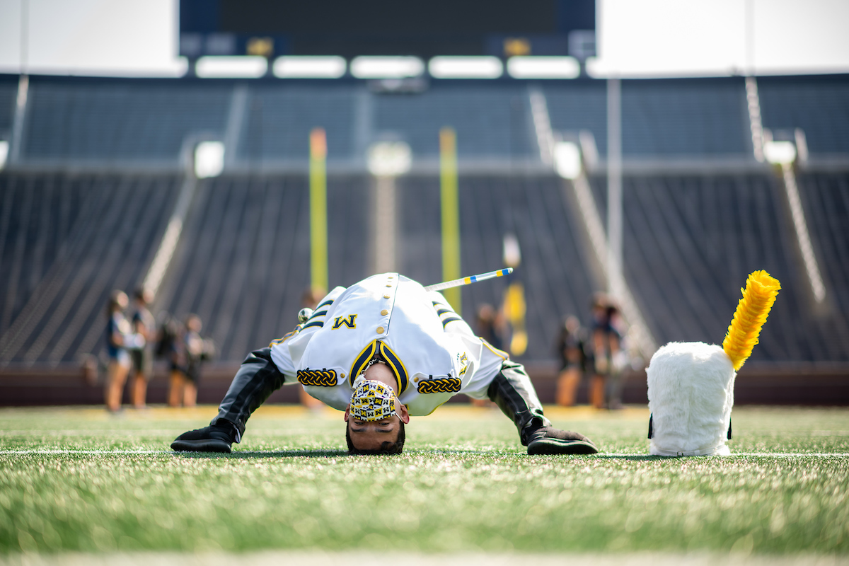 It took Drum Major Walter Aguilar about a year to perfect the iconic Michigan backbend. Image credit: Eric Bronson/Michigan Photography