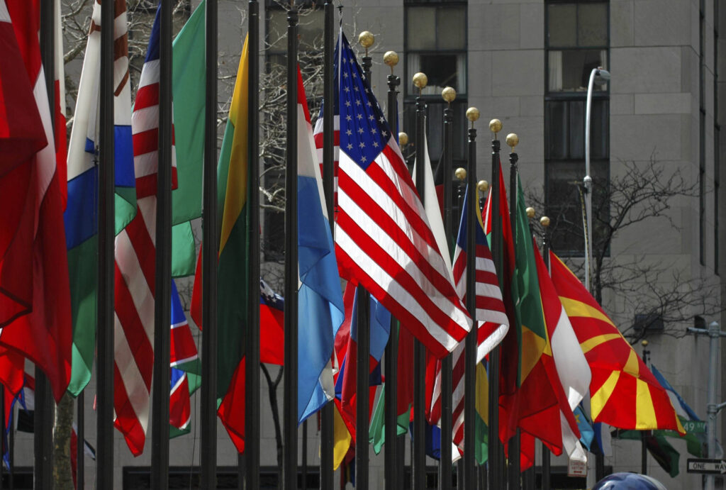 The American flag stands out among others from around the world on display at Rockefeller Center in Manhattan. Image credit: iStock