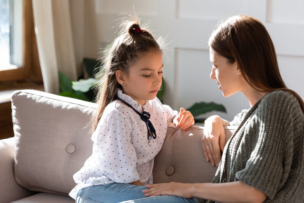 A mother and young daughter having a serious conversation. Image credit: iStock